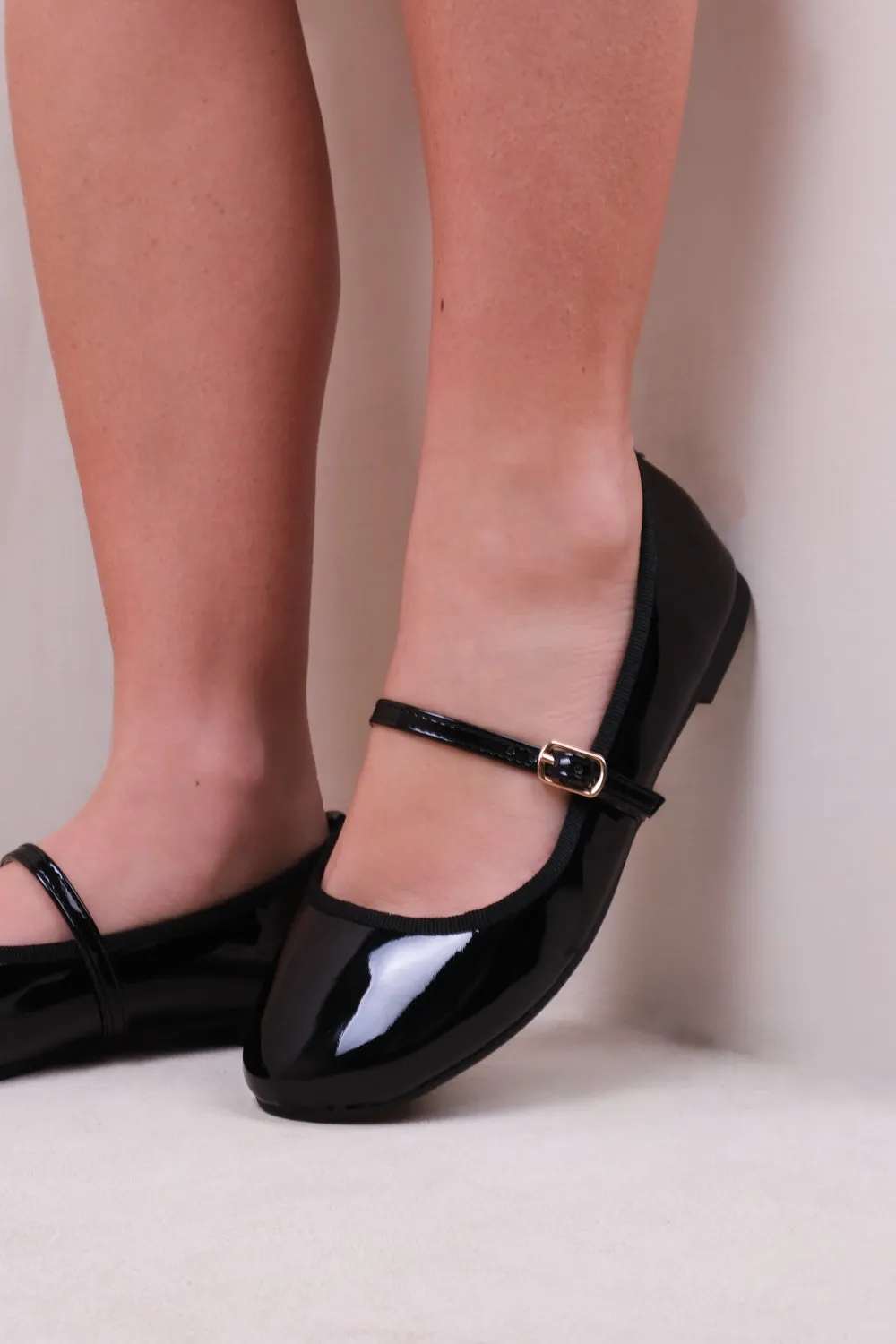 JOSIE BALLERINA FLATS WITH STRAP DETAIL IN BLACK PATENT